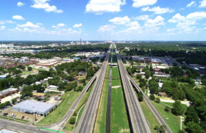 Large arial shot of highway canal route with a blue sky